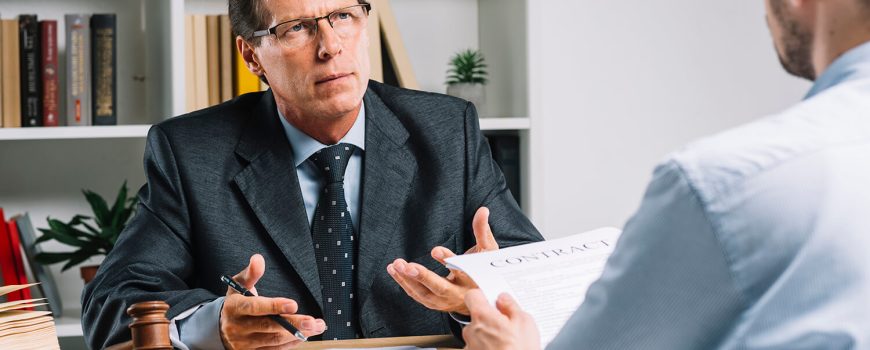lawyer-discussing-contract-with-client